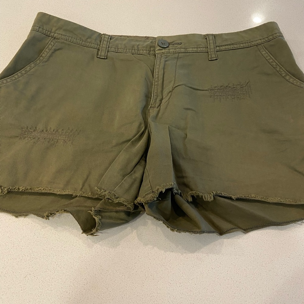 Distressed green shorts